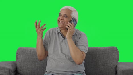 Happy-Indian-old-man-talking-on-phone-Green-screen