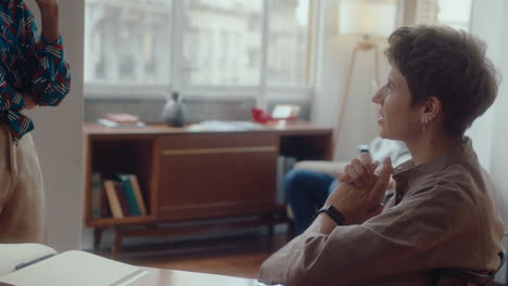 female coworkers having talk in the office