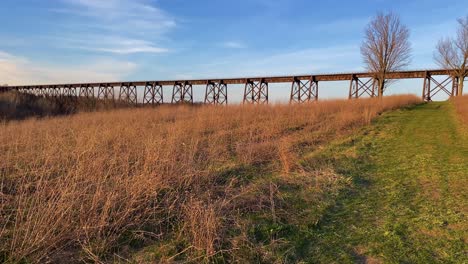 A-beautiful,-high,-steel,-beautifully-engineered-train-bridge-viaduct-in-the-Appalachian-Mountains-during-early-spring-at-sunset