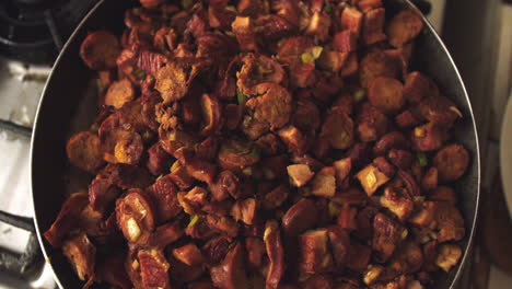 close-up of a pan with pieces of cecina, chorizo and meat