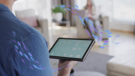 animation of purple shapes moving over caucasian man using tablet with smart home on screen