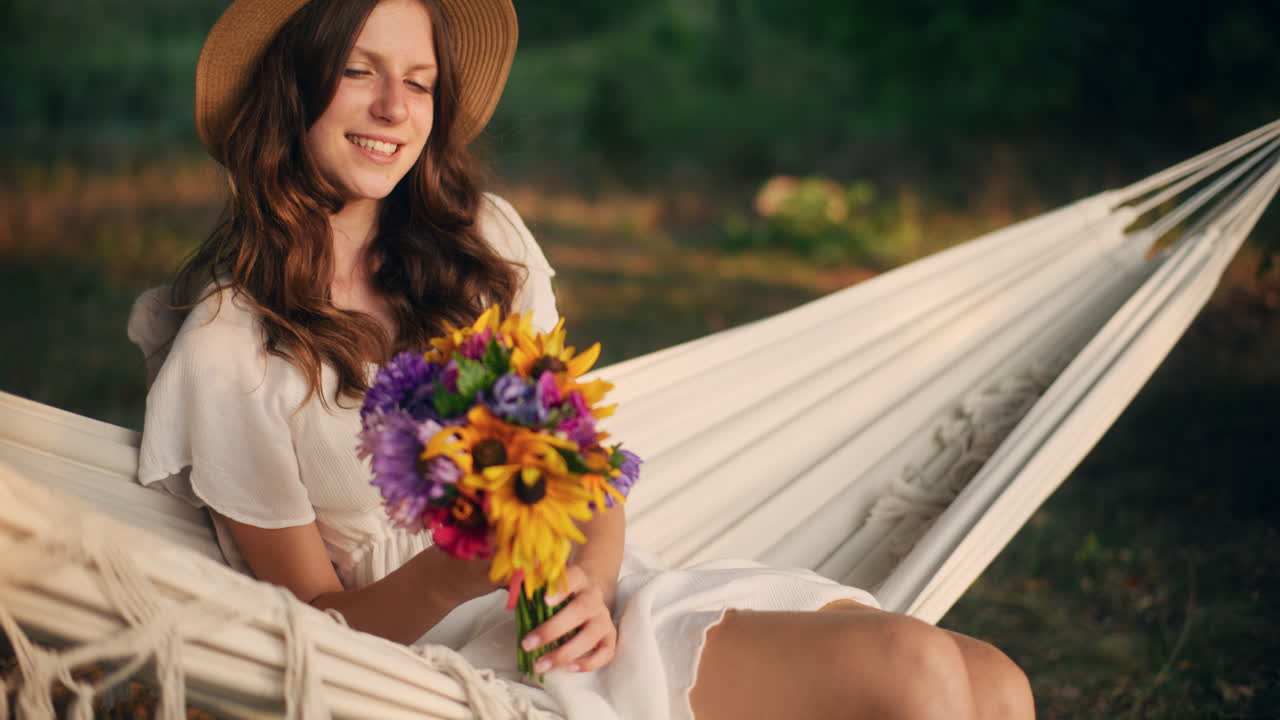 Young dreamer swaying gently in nature’s light