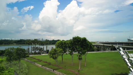 aerial over park area of marina barrage, an impressive engineering marvel and a vital part of singapore's sustainable development