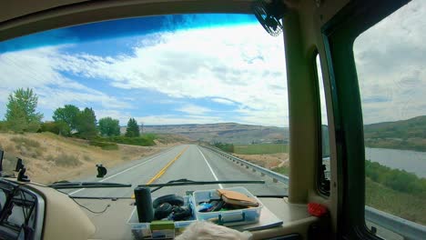 pov of the passenger in a recreational vehicle rv while driving through the scablands of east central washington state