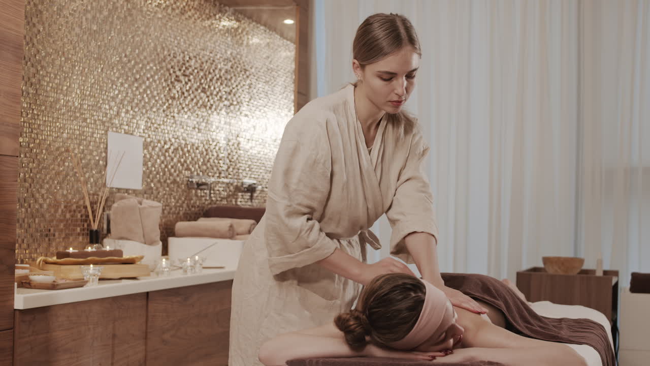 Female Masseur Working in Spa Salon