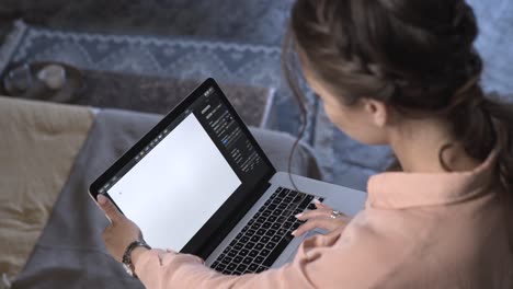 woman using a laptop at home