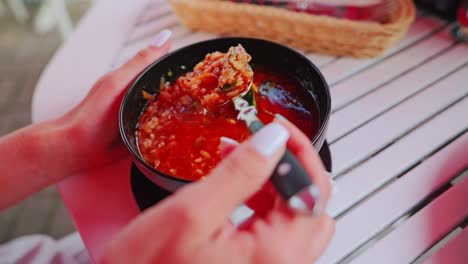 slow motion soup stirring on outdoor table – warm café vibe in latvia