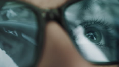 reflection of a driver in glasses