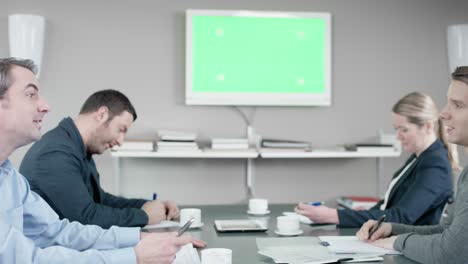 group of business people have discussion at the meetingroom in front of a greenscreen
