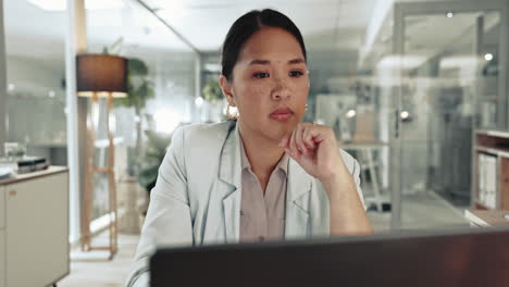 Serious, thinking and business woman on laptop