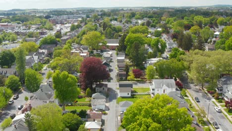 Aerial-dolly-forward-of-town-in-America-during-sunny-summer-day