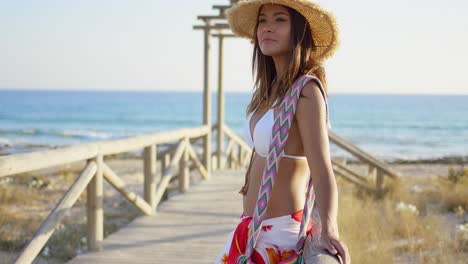 young woman on a wooden beachfront promenade