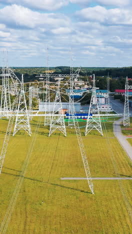 high voltage tower electricity station. aerial view of electrical voltage wires. vertical video