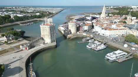 la rochelle port with chain and saint nicolas towers, france