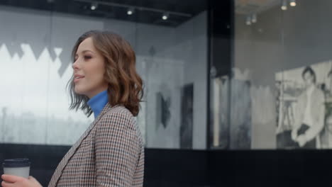 stylish woman walking in front of a shop
