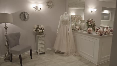 a bridal suite with a wedding gown on a white mannequin