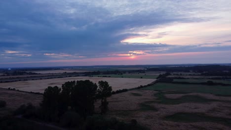 Sunrise-Over-English-Countryside-Landscape-In-Norfolk,-UK---aerial-shot