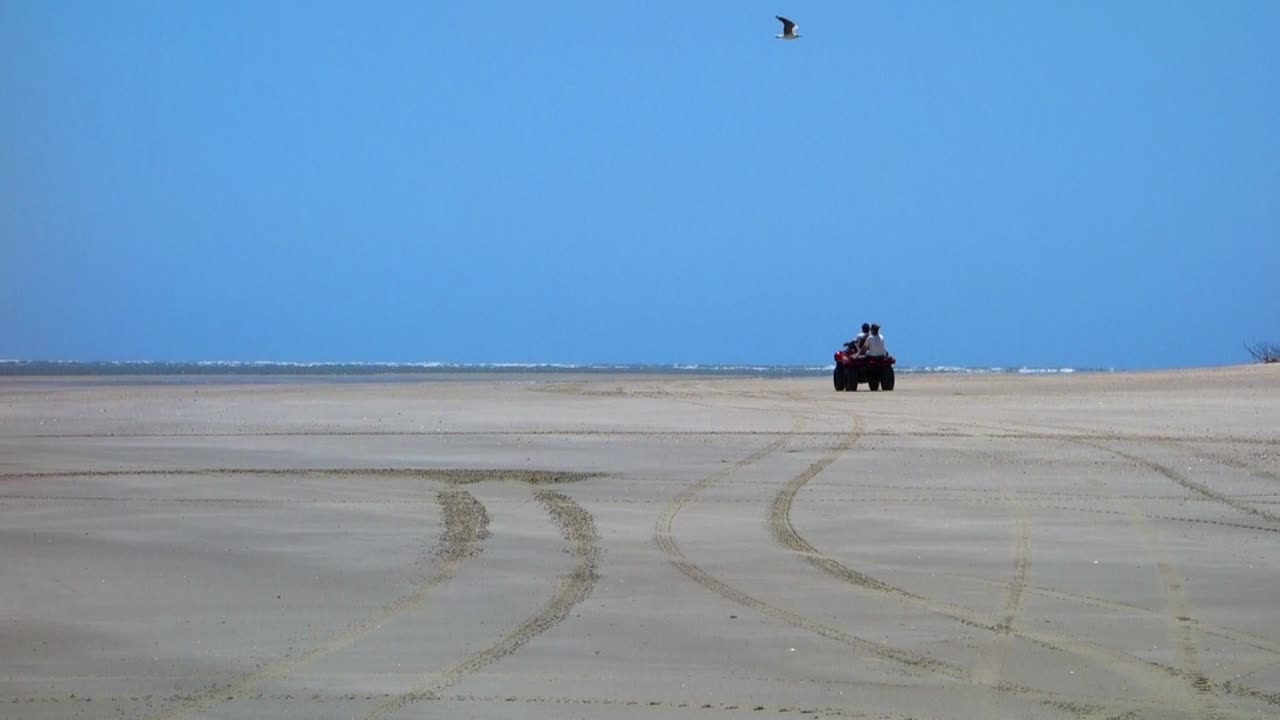 Off road 4x4 quadrycicle vehicle on dunes. Lençois Maranhenses, Maranhao, Brazil