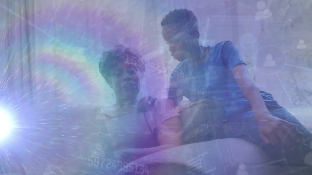 Animation of data processing over senior african american woman with grandson using laptop