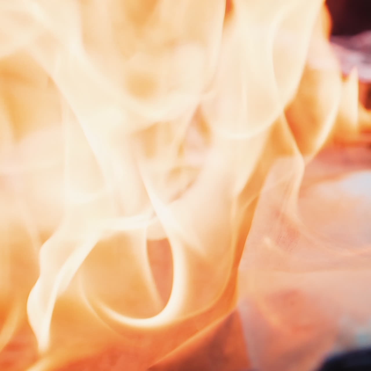 Detailed video of paper burning. Bright fire flame on smoldered logs. White paper becomes black in bonfire. Slow motion. Close-up.