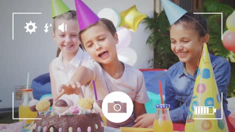 Taking-photos-of-children-at-birthday-party-on-a-digital-camera