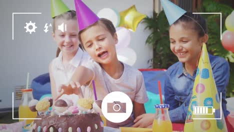 taking photos of children at birthday party on a digital camera