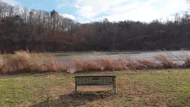 fly by over park bench towards river