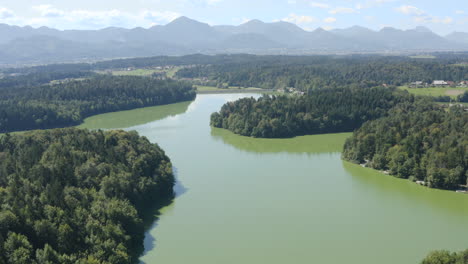 Scenic-and-beautiful-aerial-drone-landscape-over-green-coloured-lake