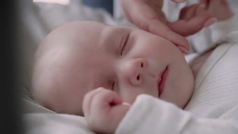 close up of  newborn sleeping in the crib