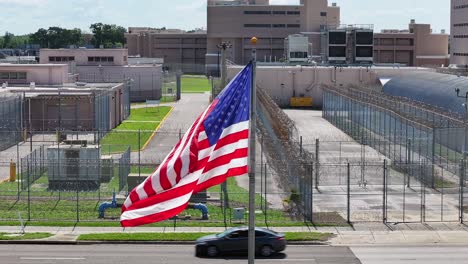 american flag flying in front of a prison facility