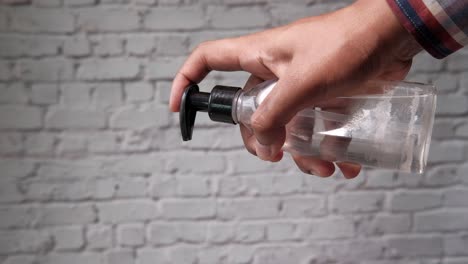 applying hand sanitizer