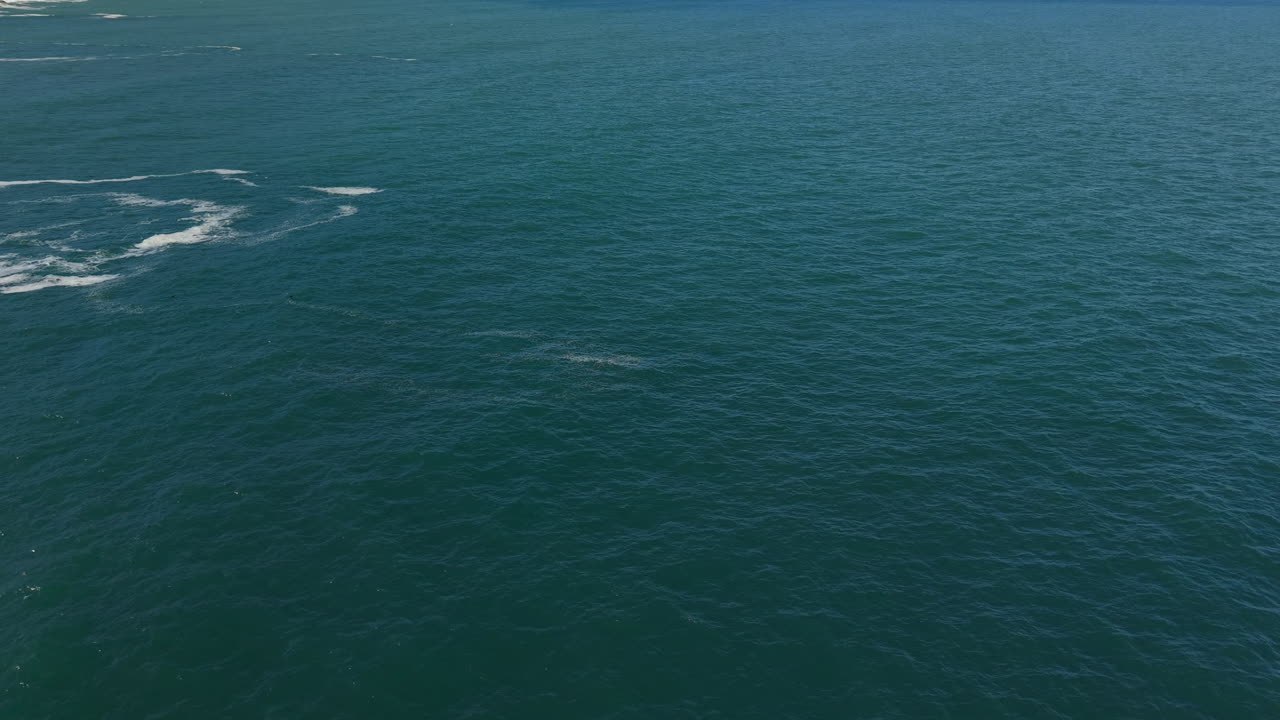 South Africa - A Wide Expanse of Deep Blue Ocean Stretches Across the Scene, Gently Rippling Beneath the Open Sky - Static Shot