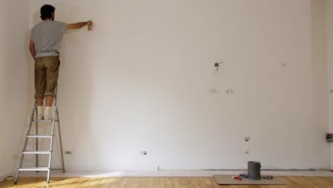 portrait of a man on the ladder, limewash paint interior