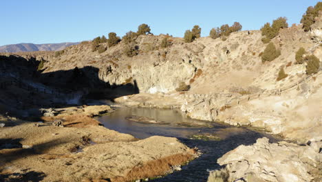 flyover water stream and hot spring, famous landmark, hot creek geological site, aerial