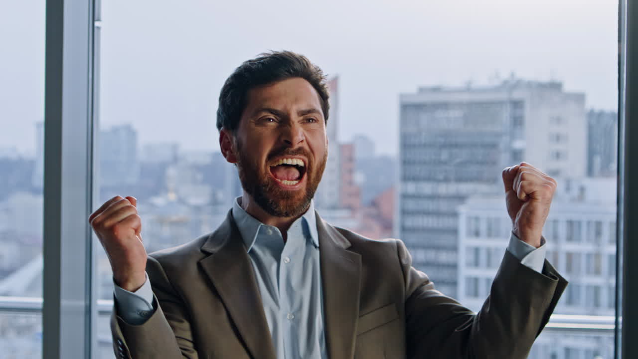 Overjoyed startuper winning deal gesturing at glass walls closeup. Man rejoicing