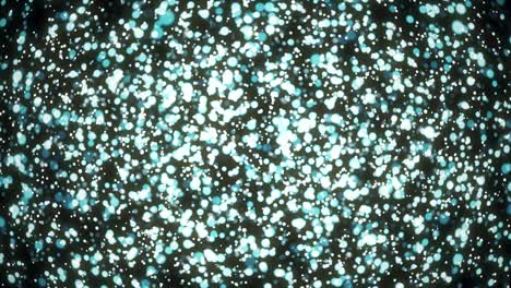 partículas de luz azul brillan bokeh en fondo negro