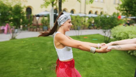 two happy women having fun in the park