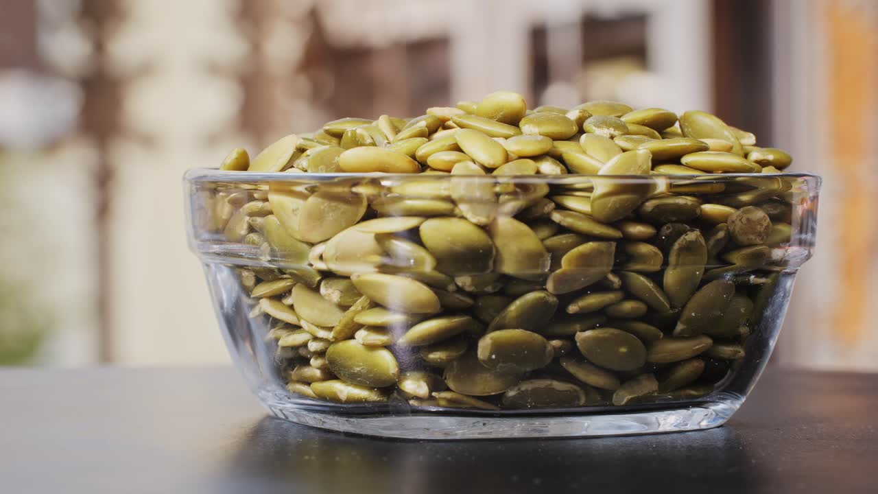 Pumpkin Seeds in a Glass Bowl