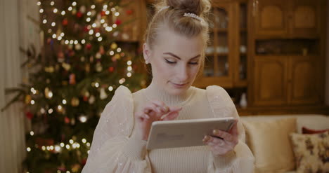 woman using digital tablet and shopping online during christmas 11