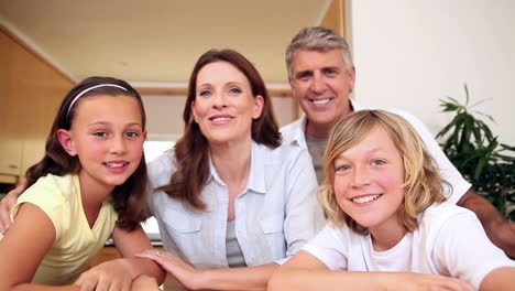 happy family waving at the camera