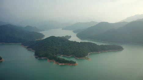 Cinematic-drone-flight-over-crocodile-island-surrounded-by-mystic-fog-in-Taiwan