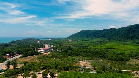 4k cinematic nature drone footage of a panoramic aerial view of the beautiful beaches and mountains on the island of koh lanta in krabi, south thailand,on a sunny day