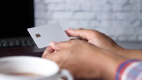 person using credit card for online payment