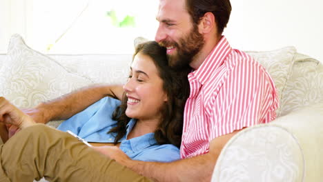 Couple-looking-at-tablet