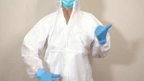 doctor with ppe suit moving and dancing with his hands