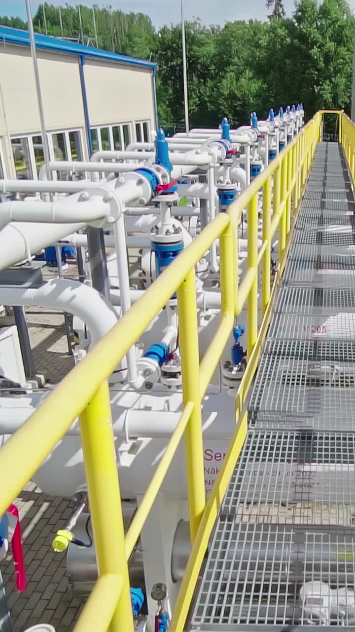 Gas processing distribution refining plant pipes refinery plant facility vertical video