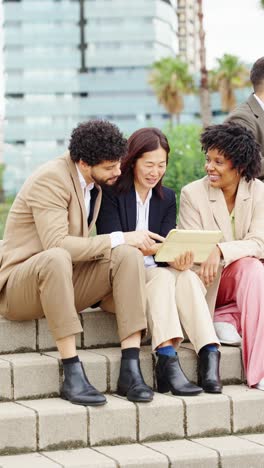 diverse business team collaborating with a tablet