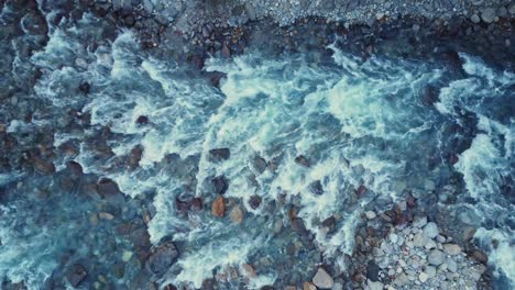 rocky river flowing though rough terrain in spain