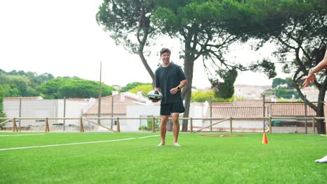 people playing rugby on grass field