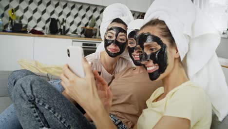 video of women making selfie with carbon facial mask